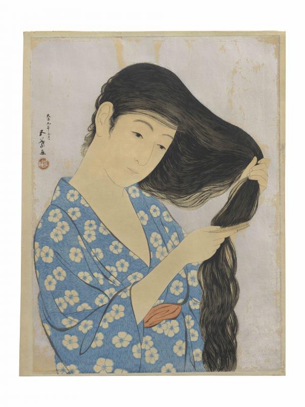 髪梳ける女